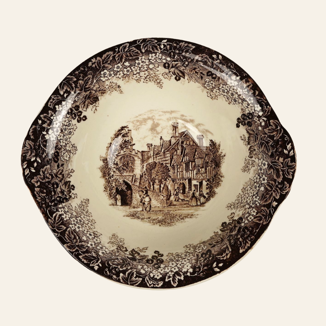 Decorative plate with vintage-style illustration of a village scene on a beige background