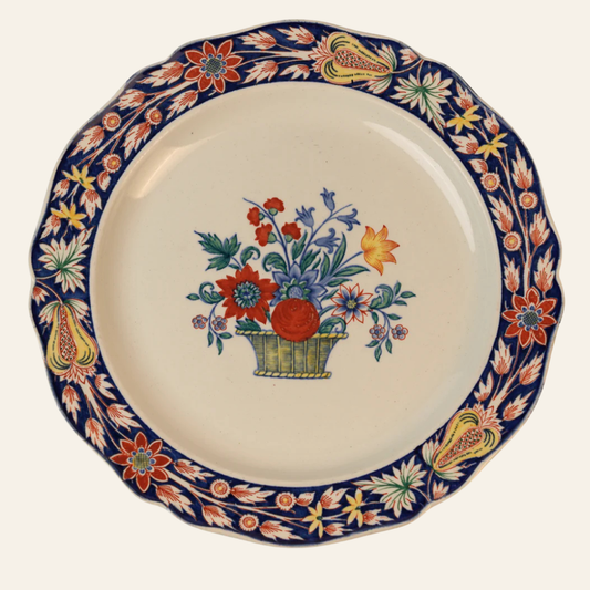 Decorative plate with floral design and colorful border on a white background - authentic antique piece
