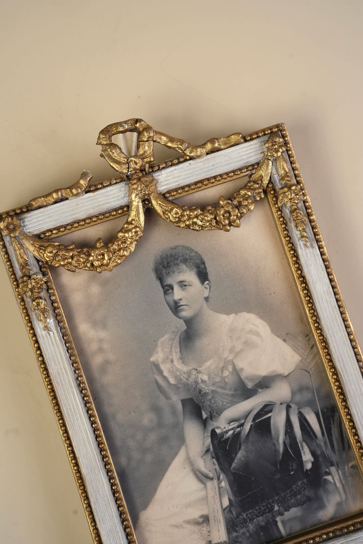 Pair of Victorian Gilt Bow Picture Frames with Original Portraits