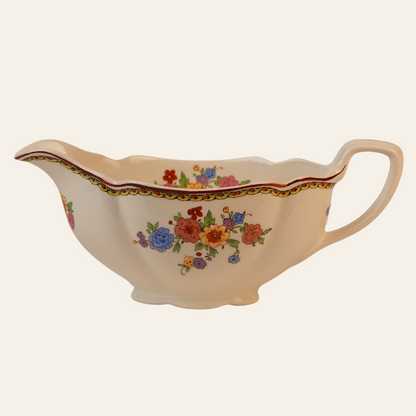 Vintage Gravy Boat With A Delicate Floral Pattern