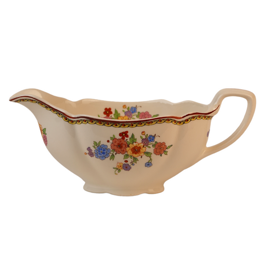 Vintage Gravy Boat With A Delicate Floral Pattern