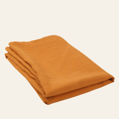 Folded orange table cover 
