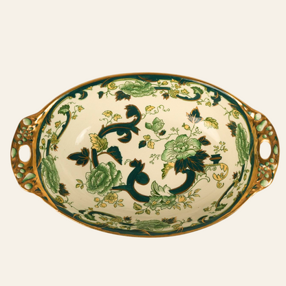 A Mason's Ironstone ceramic platter with a floral pattern in shades of green, accented with deep teal scrollwork and gold-colored handles.