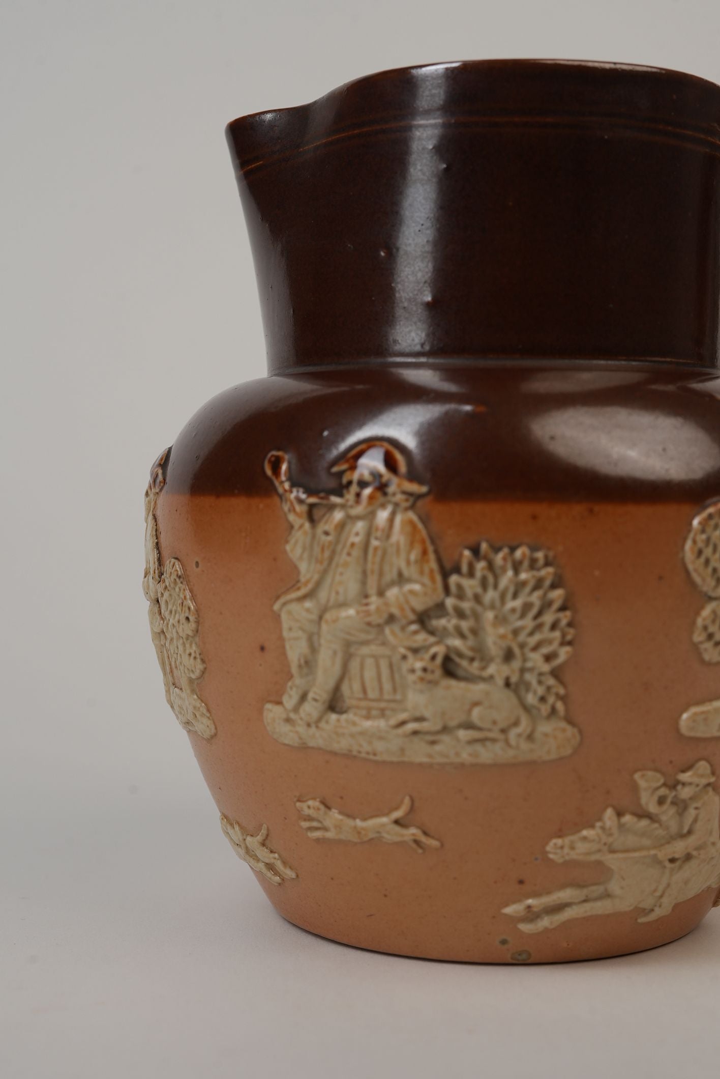 Royal Doulton Stoneware Jug with Moulded Farming Scenes, Edwardian