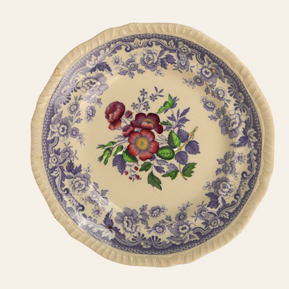A vintage Spode Copeland Mayflower side plate with a ruffled edge and a central floral design surrounded by a purple and blue patterned border.