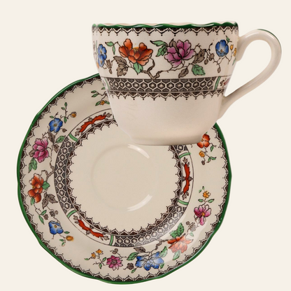 A set of two teacups with matching saucers featuring hand-painted floral patterns with green rims on a white background - Copeland Spode Chinese Rose pattern sugar bowl 