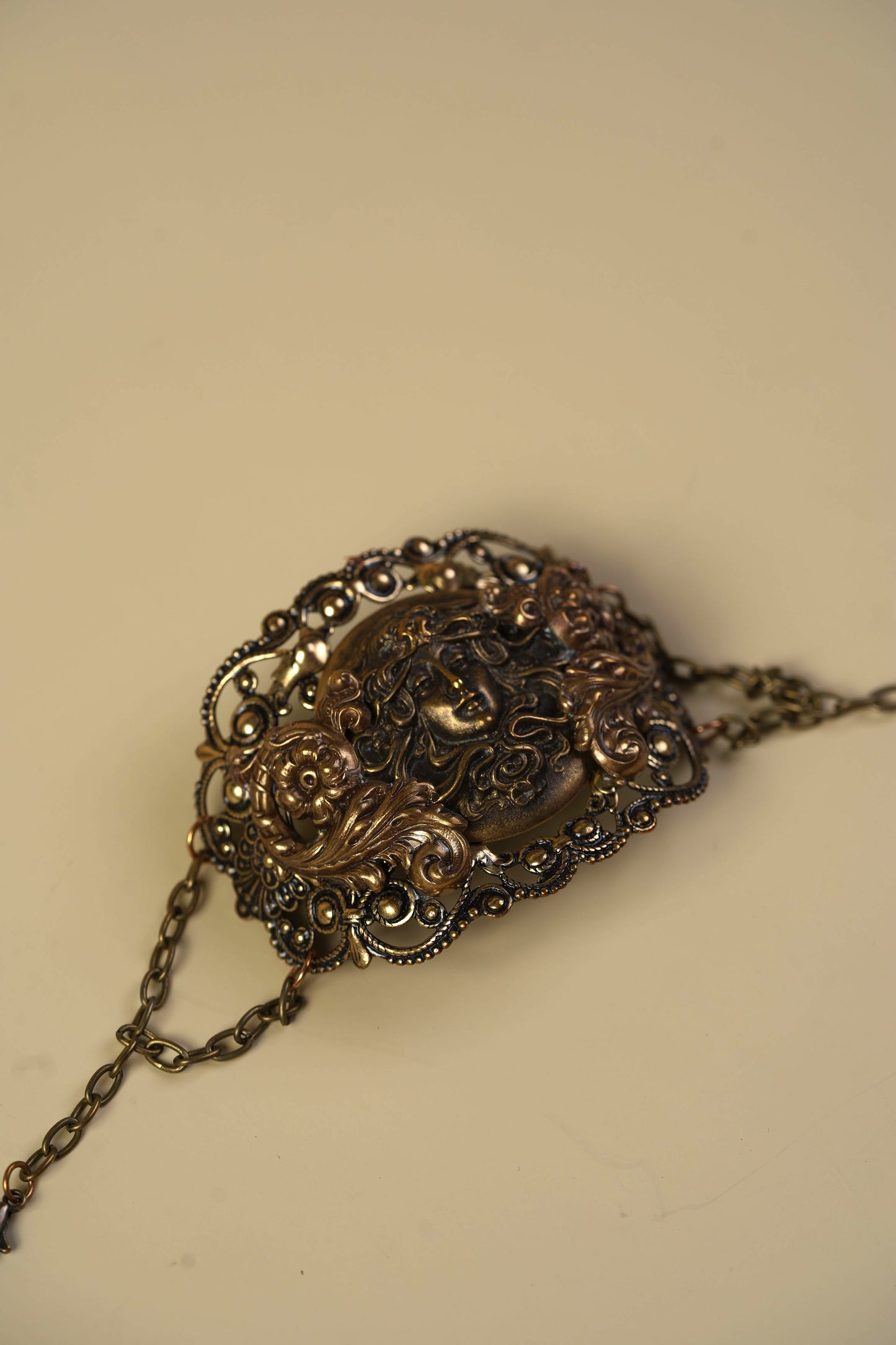 Victorian Brass Hand Cuff with Repousse Classical Face & Filigree Scrollwork