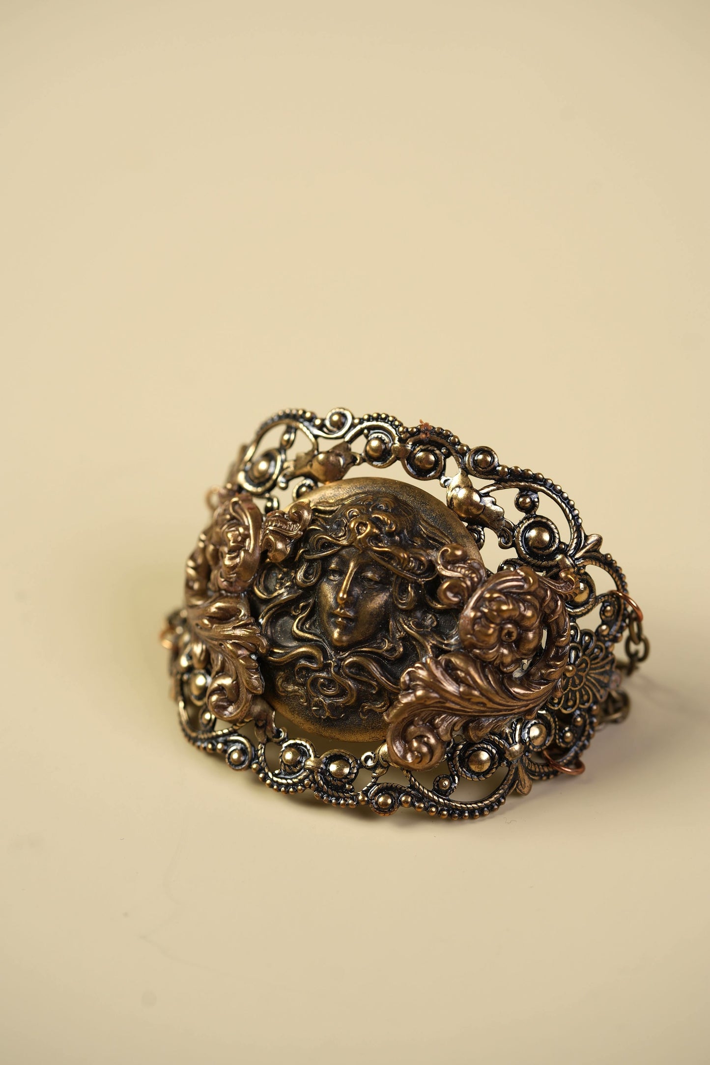 Victorian Brass Hand Cuff with Repousse Classical Face & Filigree Scrollwork