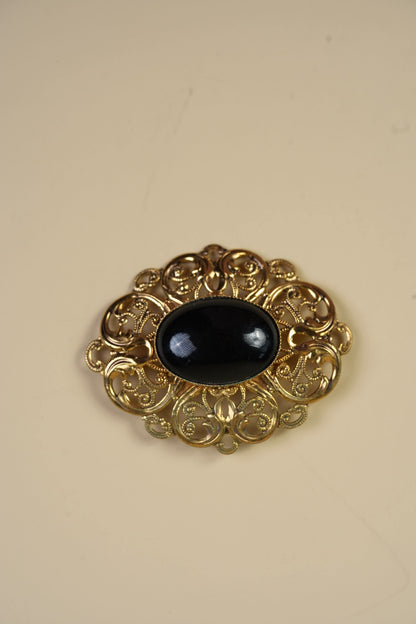 Vintage Black Cabochon Brooch in Gold-Tone Filigree Frame