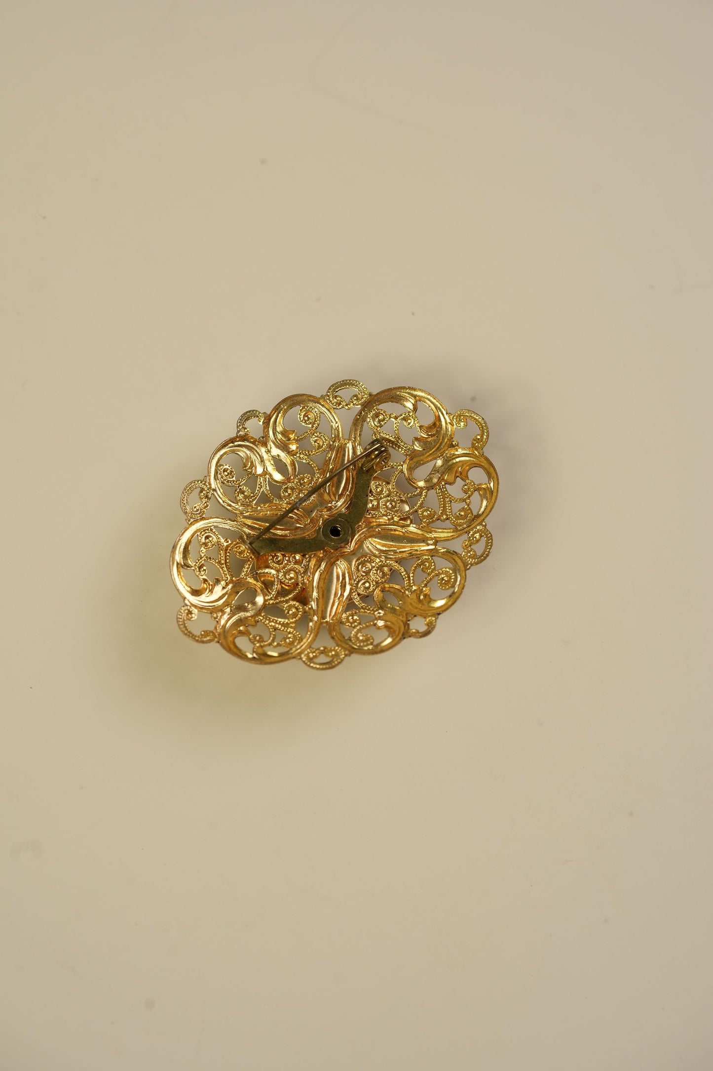 Vintage Black Cabochon Brooch in Gold-Tone Filigree Frame
