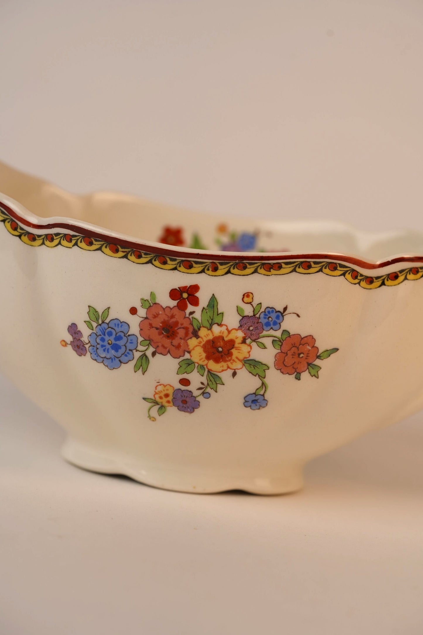 Vintage Gravy Boat With A Delicate Floral Pattern