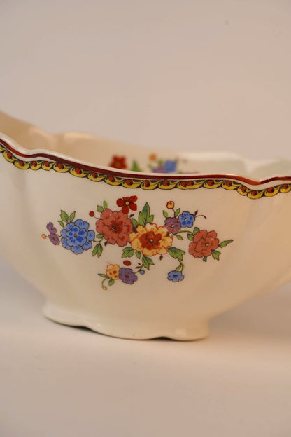 Vintage Gravy Boat With A Delicate Floral Pattern