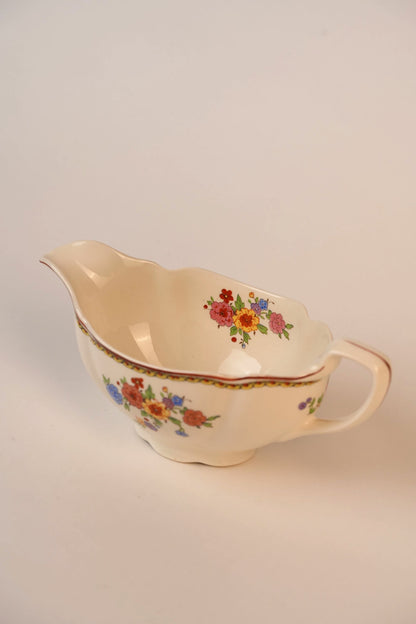 Vintage Gravy Boat With A Delicate Floral Pattern