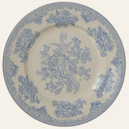 A round, blue and white porcelain dinner plate with a floral and pheasant pattern. authentic antique