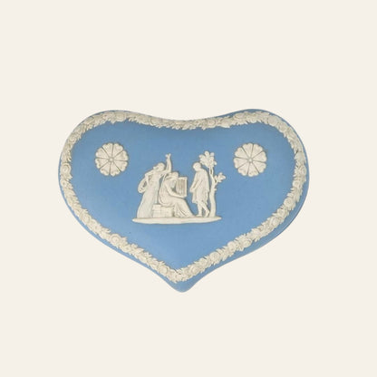 A heart-shaped, pastel blue Wedgwood trinket box with white bas-relief designs depicting neoclassical motifs.