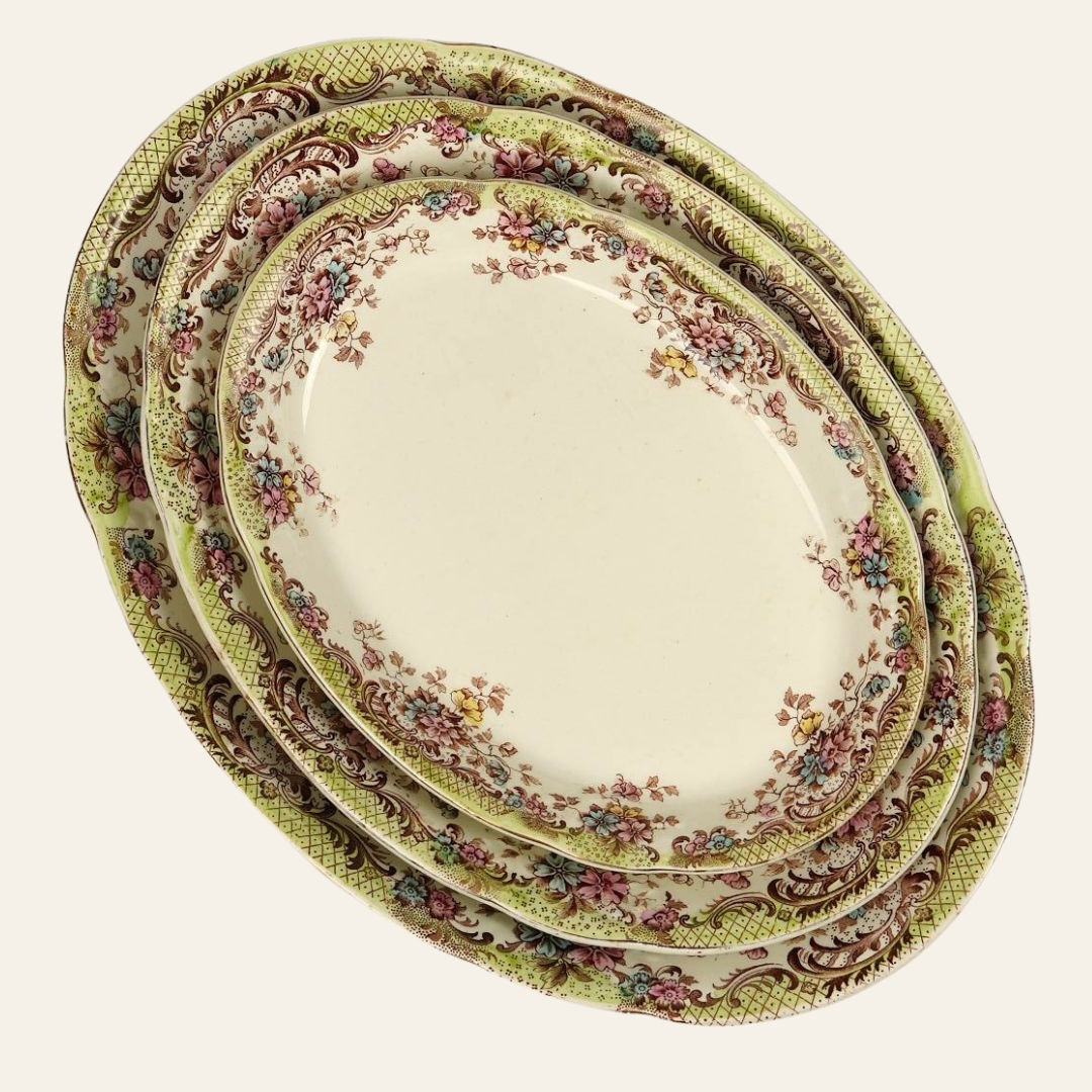 Set of decorative vintage plates with floral patterns on a light background