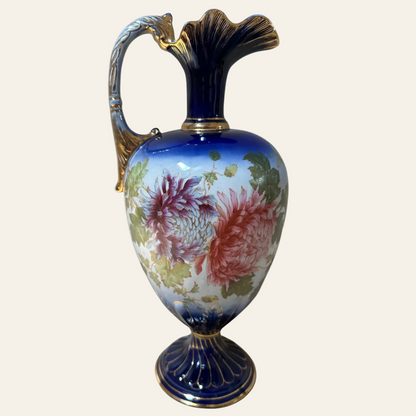 Decorative vase with floral design and gold accents on a white background
