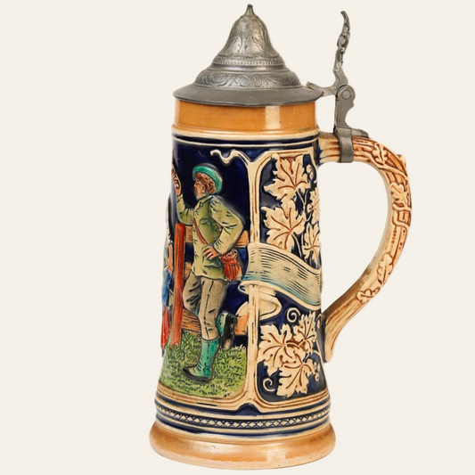 A vintage German beer stein with a colorful floral and folklore-themed design, featuring a lid and a handle.