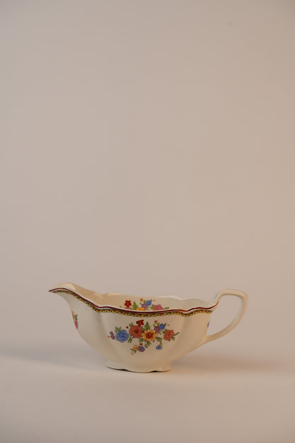 Vintage Gravy Boat With A Delicate Floral Pattern