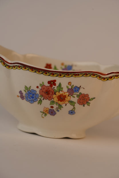 Vintage Gravy Boat With A Delicate Floral Pattern