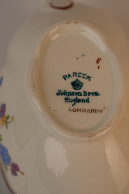 Vintage Gravy Boat With A Delicate Floral Pattern